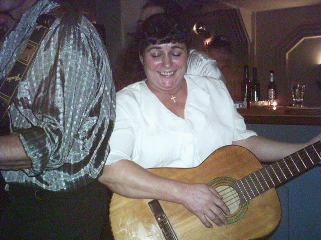 Maria jamming on the guitar