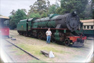 Ray Pasnen in front of a locomotive steam engine - pic.